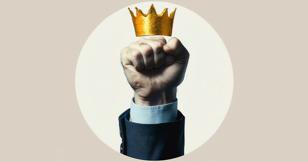 A fist in the air with a crown on top of the fist